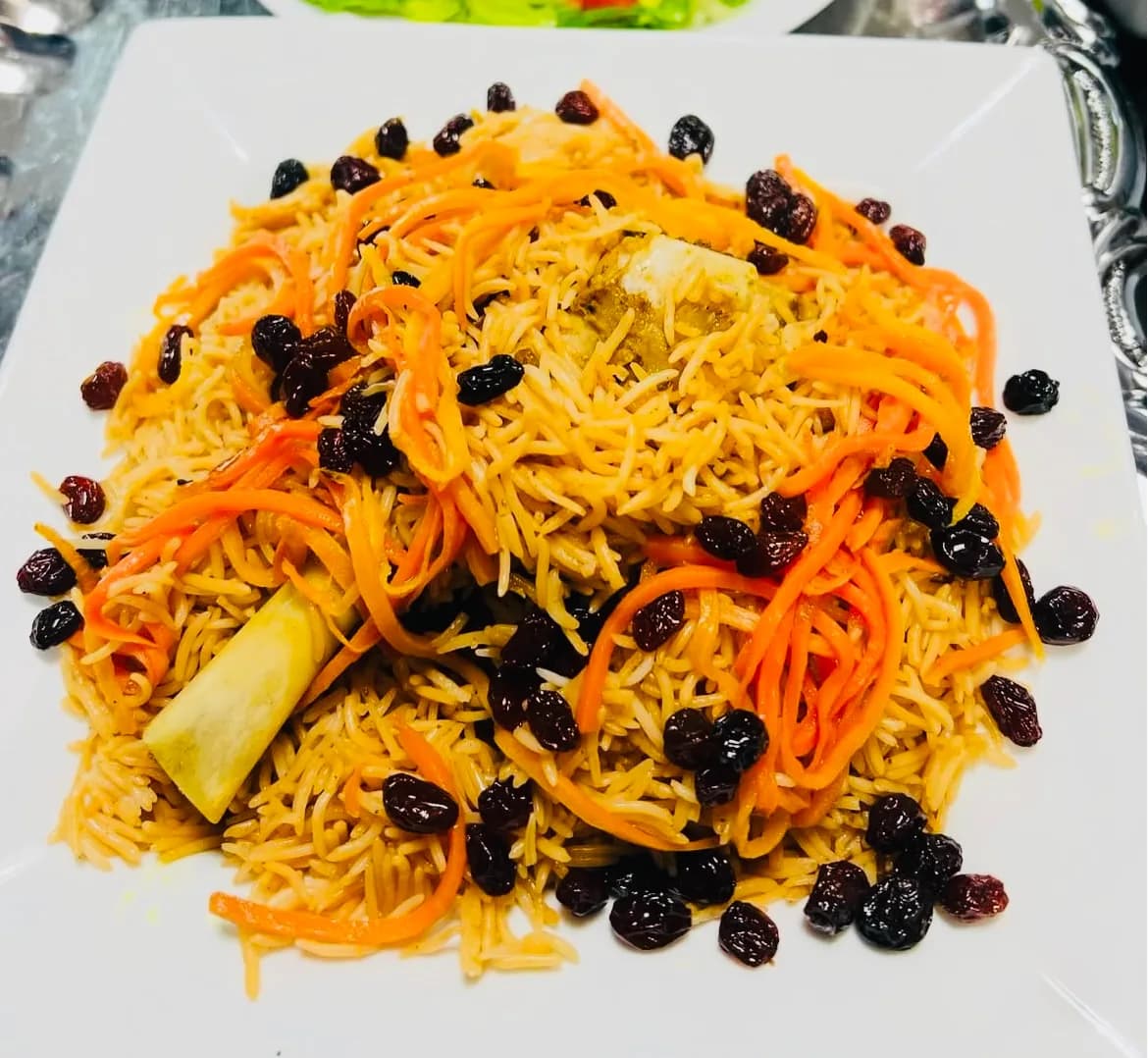 Qabli Palow — rice with caramelised carrots and raisins, with Lamb Shank
